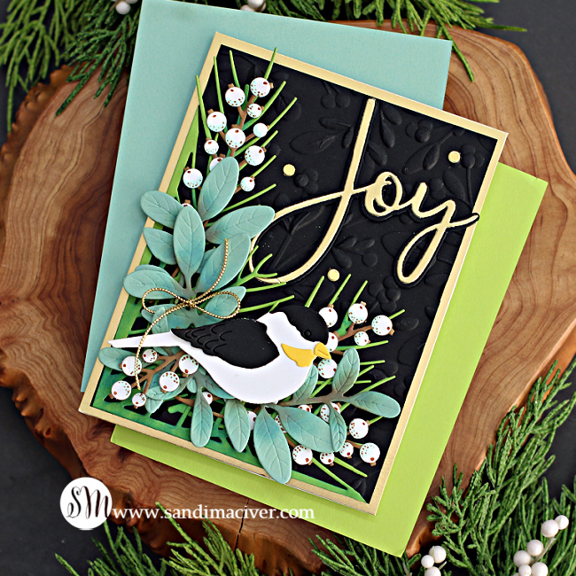 hand made christmas card with die cut foliage and a black and white bird created with new card making supplies from Simon Says Stamp