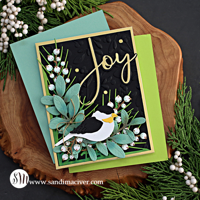 hand made christmas card with die cut greetery and a black and white bird created with new card making supplies from Simon Says Stamp