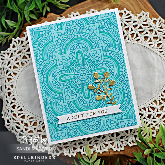 teal card with a mosaic impressed image created with new card making supplies from Spellbinders