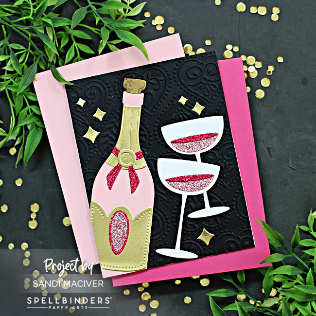 hand made new years eve card with a die cut champagne bottle and two glasses created with card making supplies from Spellbinders