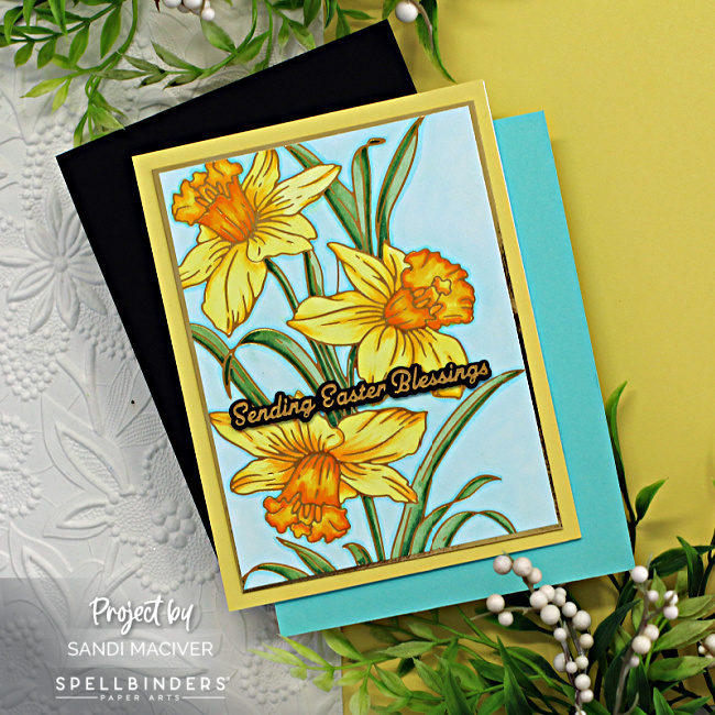 hand made easter card with yellow and orange daffodils on a turquoise background created with new card making supplies from Spellbinders 