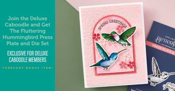 pink hand made card with an arch and two watercolored humming birds created with new card making products from Spellbinders