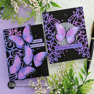 two hand made black cards with a purple mandala overlay and decorated with purple butterflies