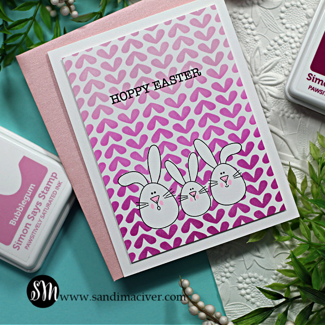 hand made easter card with three little bunnies and a heart design wallpaper background created with new card making supplies from Simon Says Stamp