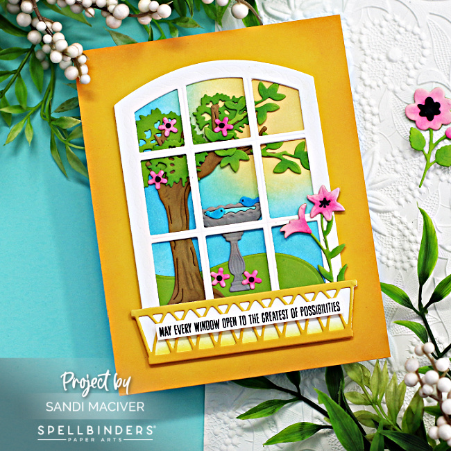 hand made gold greeting card with a white window showing a beautiful spring garden with a tree and birdbath created with new card making supplies from Spellbinders