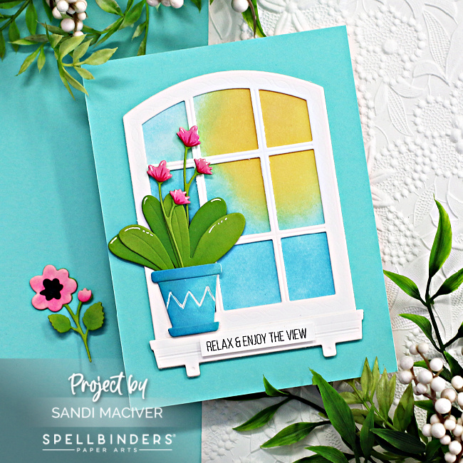 hand made greeting card with a blue front and a white window with a potted pink orchid on the left side, created with new card making products from Spellbinders