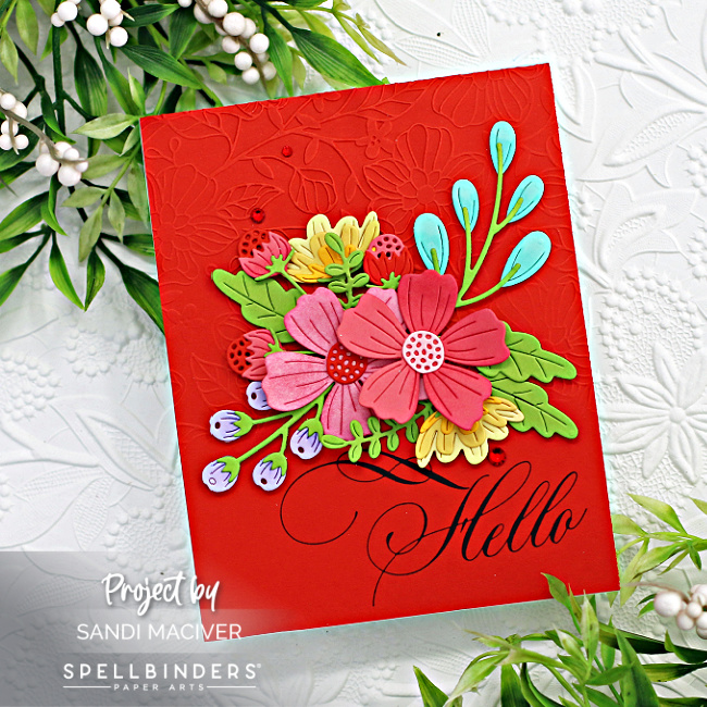 red embossed hand made card with a large hello sentiment and a bouquet of red, pink and yellow die cut flowers created with new card making supplies from Spellbinders 