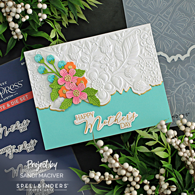 turquoise and white embossed card with a floral overlay and a Mother's Day sentiment created with new card making supplies from Spellbinders 