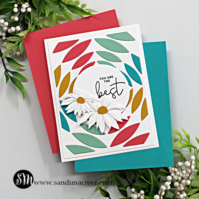 hand made card with a kaleidoscope of colors peaking through a white die cut background created with new card making products from Simon Says Stamp