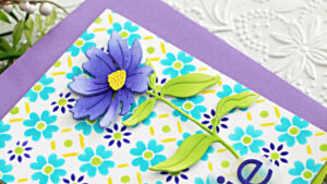 hand made card with a blue and purple background and a large purple flower created with new card making supplies from Simon Says Stamp