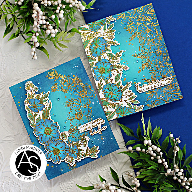 two teal blue hand made cards with blue and green flowers over a gold embossed background created with new card making supplies from Alex Syberia Designs