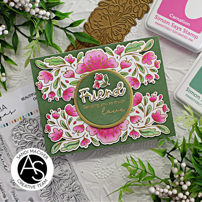 pink and green hand made card with a border of flowers top and bottom and a green circle with the sentiment in the center created with new card making products from Alex Syberia Designs