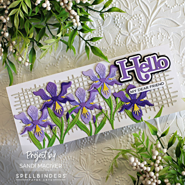 white slimline card covered in purple die cut Iris created with new card making supplies from Spellbinders