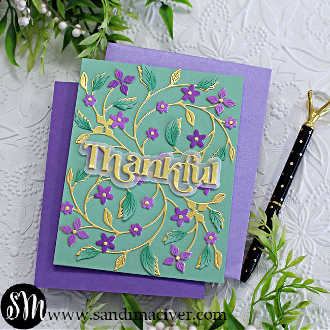 hand made card with a pale mint base, gold die cut leaves and stems and purple flower overlays created with new card making products from Simon Says Stamp