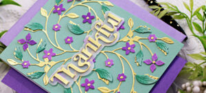 A bridgerton Dress Copy pale green card with gold stems and purple flowers created with new card making products from Simon Says Stamp