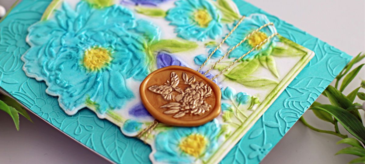 hand made teal colored card peonies and butterflies embossed on a arched insert in purple, blue, green and yellow created with new card making supplies from Spellbinders