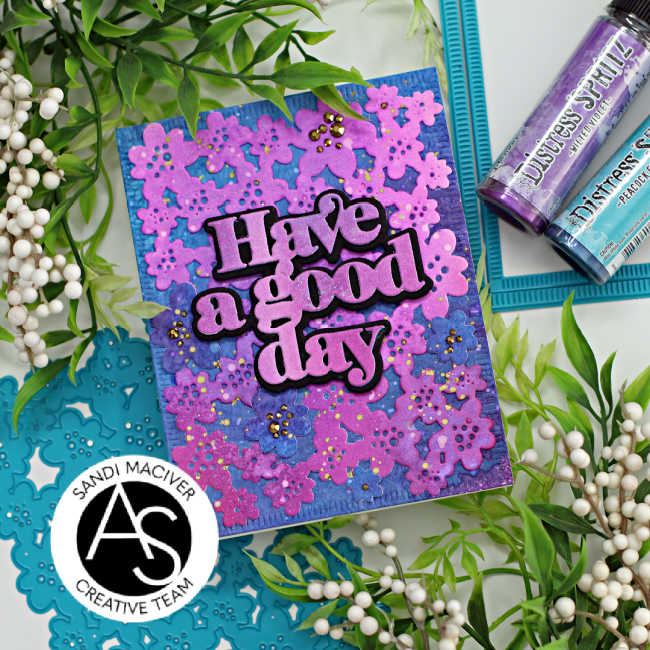 hand made greeting card in shades of purple and blue with a die cut floral background and a large print have a good day sentiment created with card making supplies from Alex Syberia Designs