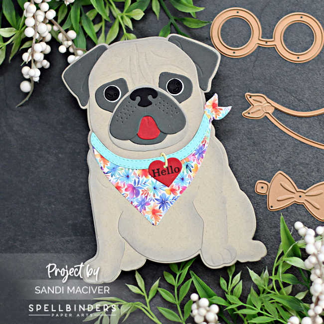 hand made die cut card in the shape of a pug in light and dark brown with a rainbow colored bandana, created with new card making supplies from Spellbinders