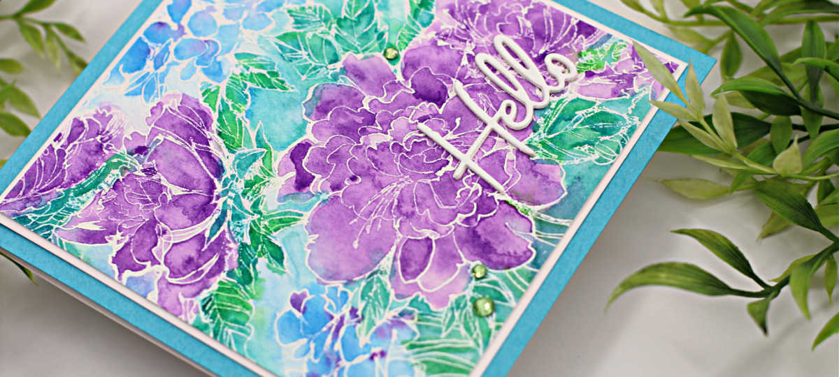 hand made square card with a bouquet of flowers in purples and blues with green leaves created with new card making products from Spellbinders