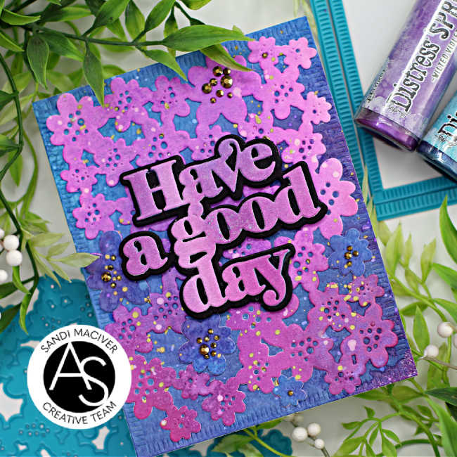 hand made greeting card in shades of purple and blue with a die cut floral background and a large print have a good day sentiment created with card making supplies from Alex Syberia Designs