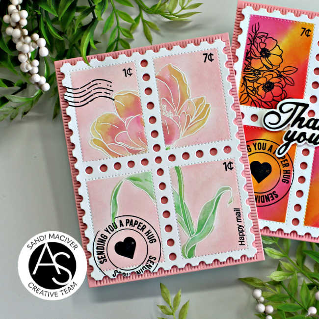 hand made pink and yellow card with 4 stamp squares and a large pink tulip in the center with yellow tips and green leaves