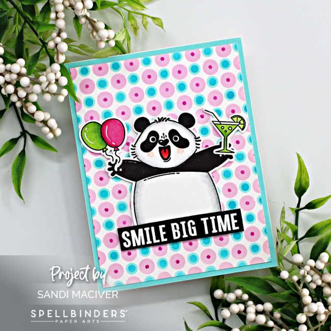 hand made birthday card with a celebrating panda holding balloons and a drink with a pink and blue polka dot background