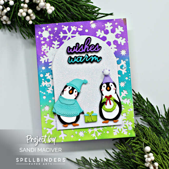 hand made Christmas cards in purple, teal and green with little penguins dressed up for winter in sweaters and touques