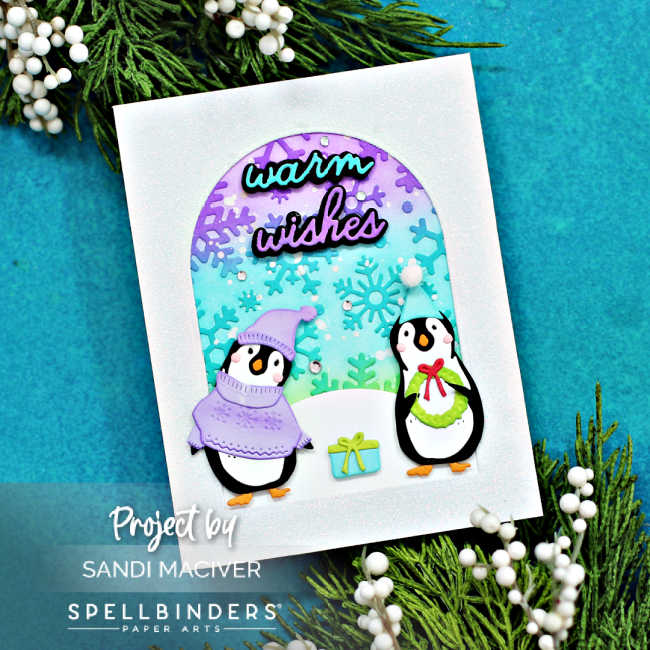 hand made Christmas cards in purple, teal and green with little penguins dressed up for winter in sweaters and touques