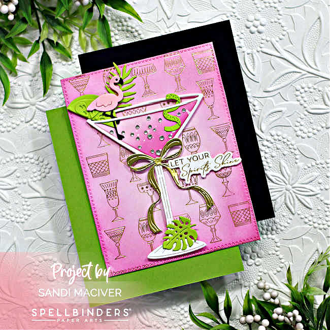 hand made card with a white die cut martini glass on a pink and gold embossed background with a lime wedge and curl and a flamingo stir stick