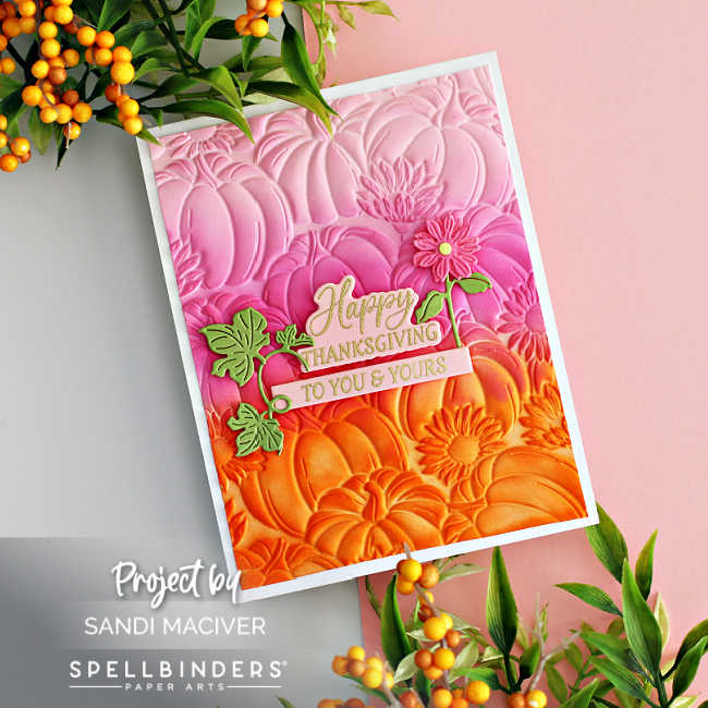 hand made fall card with embossed pumpkins ink blended in orange and pink with a pink and gold sentiment in the center