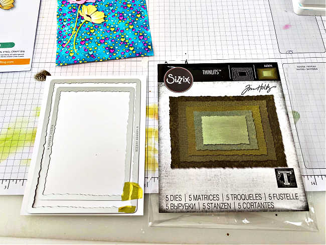 cutting a frame using the Tim Holtz Stacked Deckle Dies