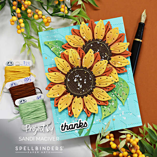 hand made teal card with two large yellow and rust colored stitched sunflowers with green stitched leaves