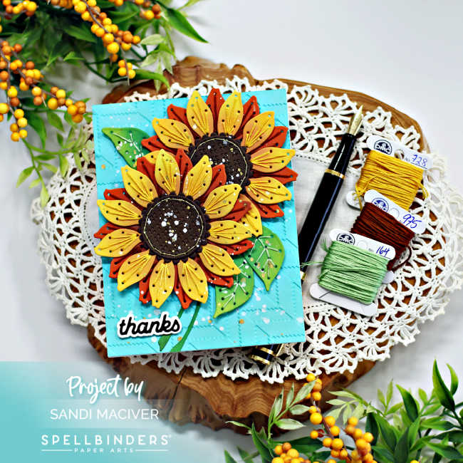 hand made teal card with two large yellow and rust colored stitched sunflowers with green stitched leaves