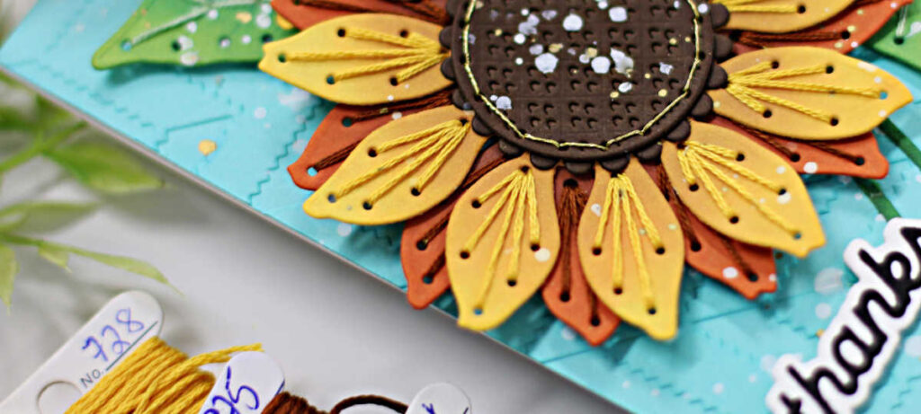 Spellbinders Stitched Sunflowers on a turquoise card