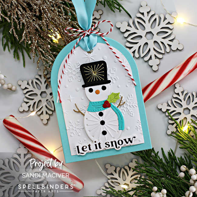 die cut snowman with a stitched tummy and hat added to a teal and white christmas tag