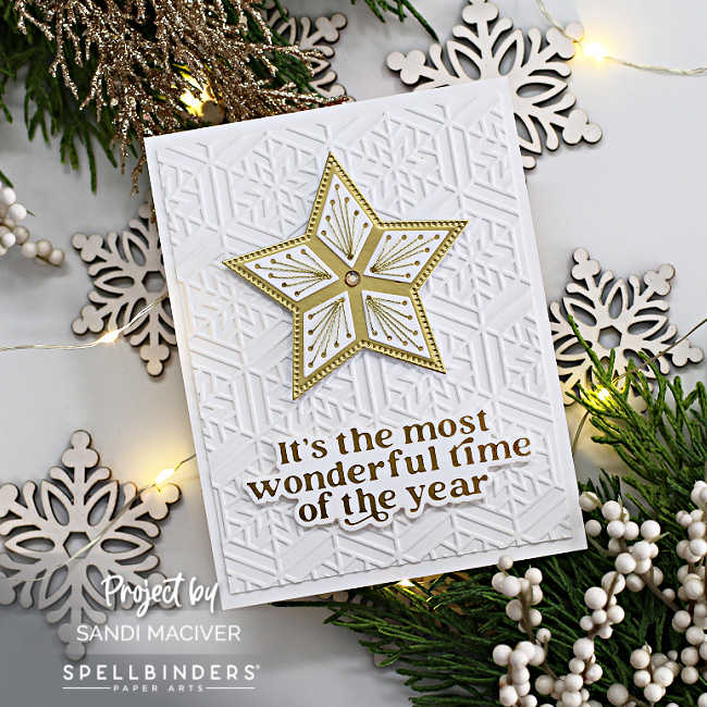 hand made gold and white Christmas card with an embossed background and a gold and white stitched star in the center