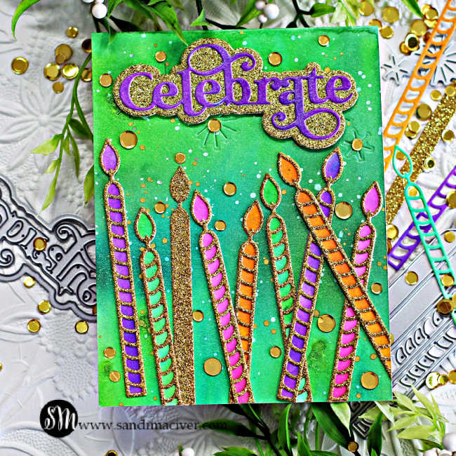 hand made birthday cards with a watercolor green and blue background and multi colored large candles strewn across the bottom