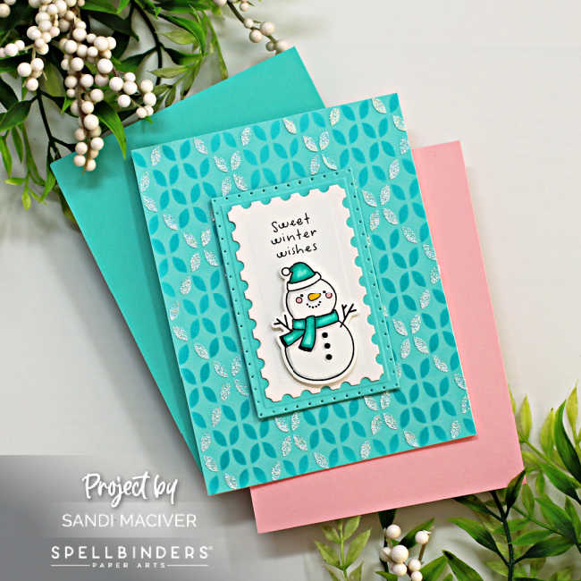 hand made christmas card with a argyle stenciled background and a cute snowman with a turquoise hat and scarf