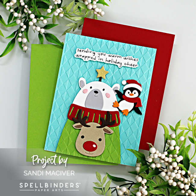 hand made christmas card with a polar bear wearing an Ugly Christmas Sweater with a reindeer on it and a penguin on his shoulder 