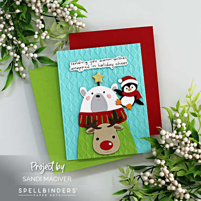 hand made christmas card with a polar bear wearing an Ugly Christmas Sweater with a reindeer on it and a penguin on his shoulder 