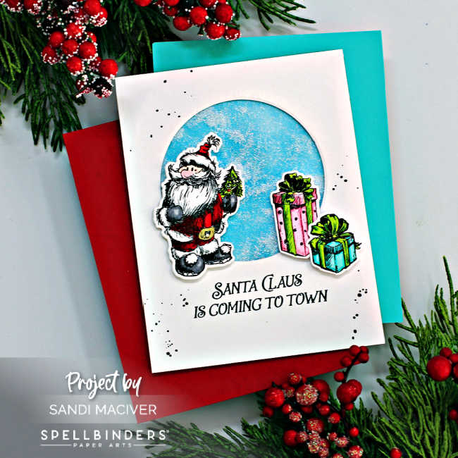 white hand made christmas card with a circle cut out and glitter shaker inside with a hand sketched santa overlay and pink and turquoise parcels