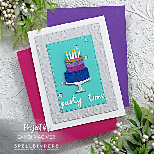 masculine birthday card with a purple and blue die cut cake atop a silver plater with a gray and white embossed background