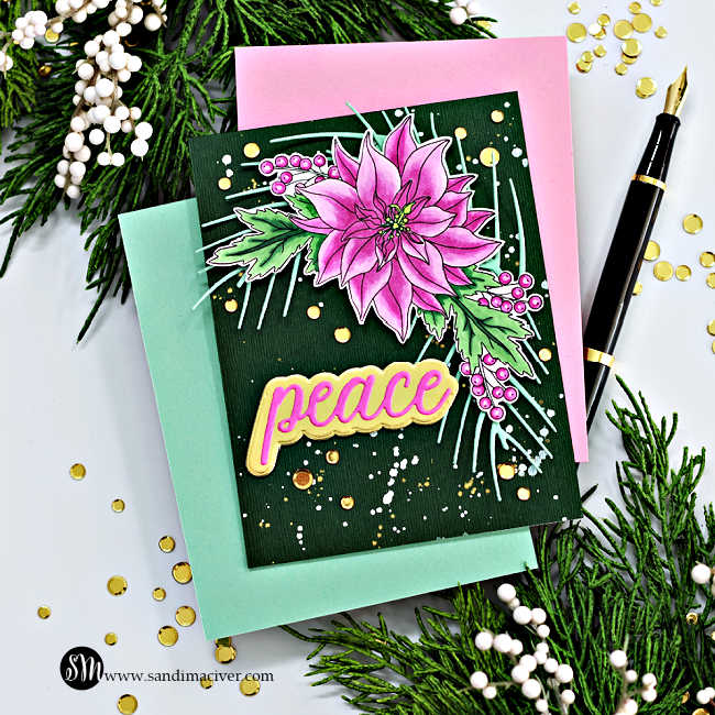 hand made christmas card with a dark green background splattered with white and gold paint, and overlay of a pink poinsettia spray with mint green leaves and a die cut sentiment saying peace.