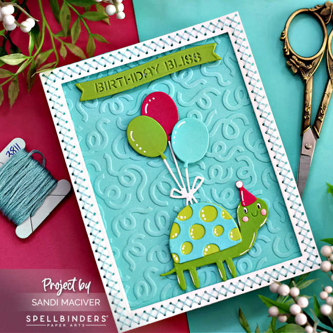 hand made childrens birthday card with a green and turquoise turtle holding balloons with a white stitched border