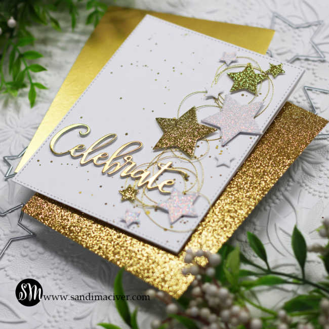 white card covered in gold and white glimmer stars down the right side and the word celebrate in gold