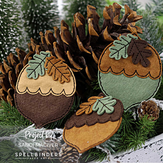 3 felt hand stitched acorns in browns and greens with brown stitching