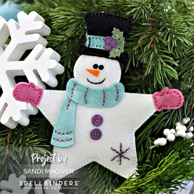 white felt snowman with a teal scarf and pink gloves 