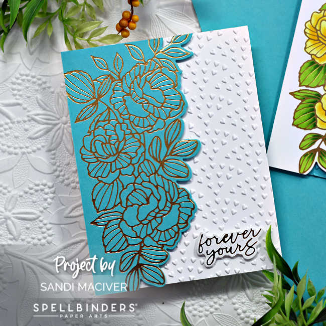 White hand made card with a gold foiled floral design on turquoise down the left side