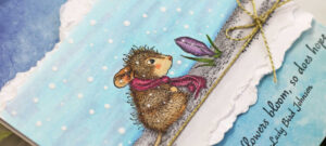 hand made greeting card with a stamped and colored little mouse staring at a crocus in the snow