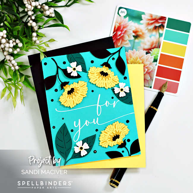 hand made teal card with yellow flowers and black leaves with a center sentiment in white foil